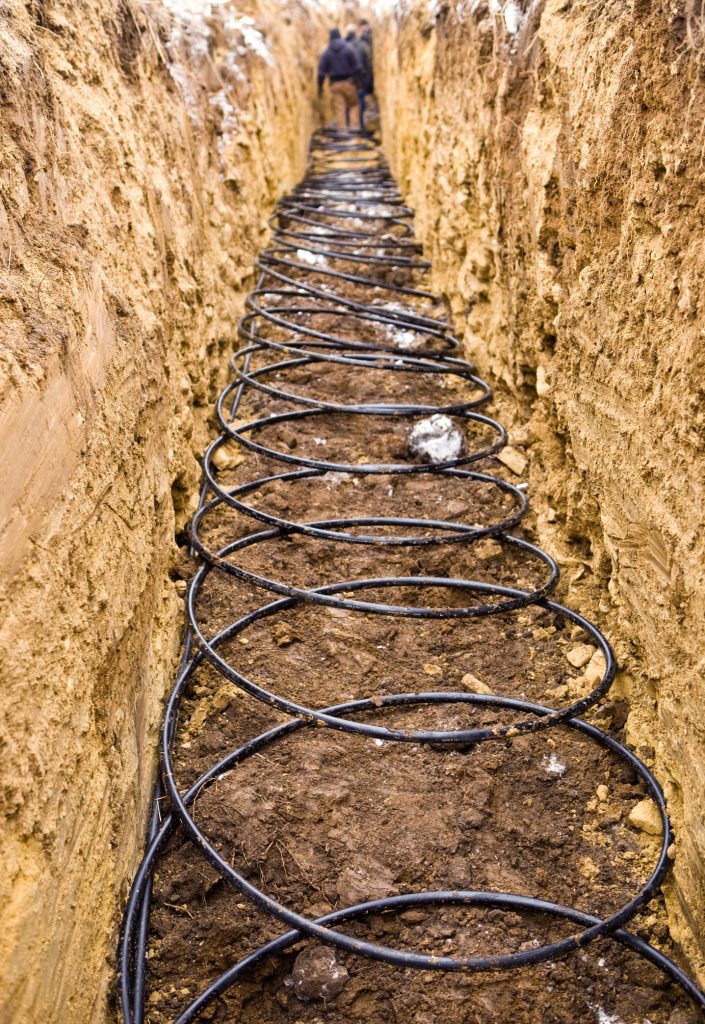 Geothermal heat pump pipes installation 6 feet in the ground